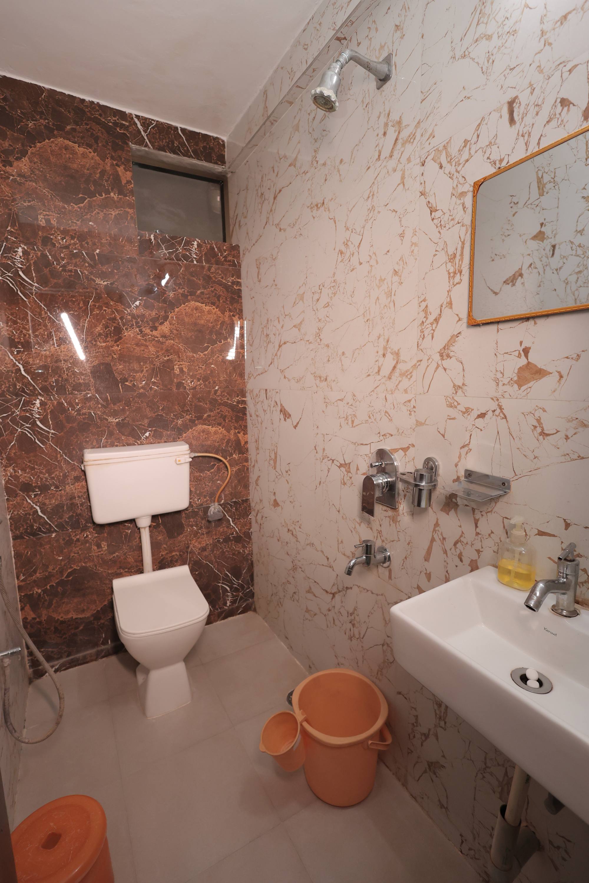 The attached Western-style bathroom in the AC Room at Hotel Relax Inn