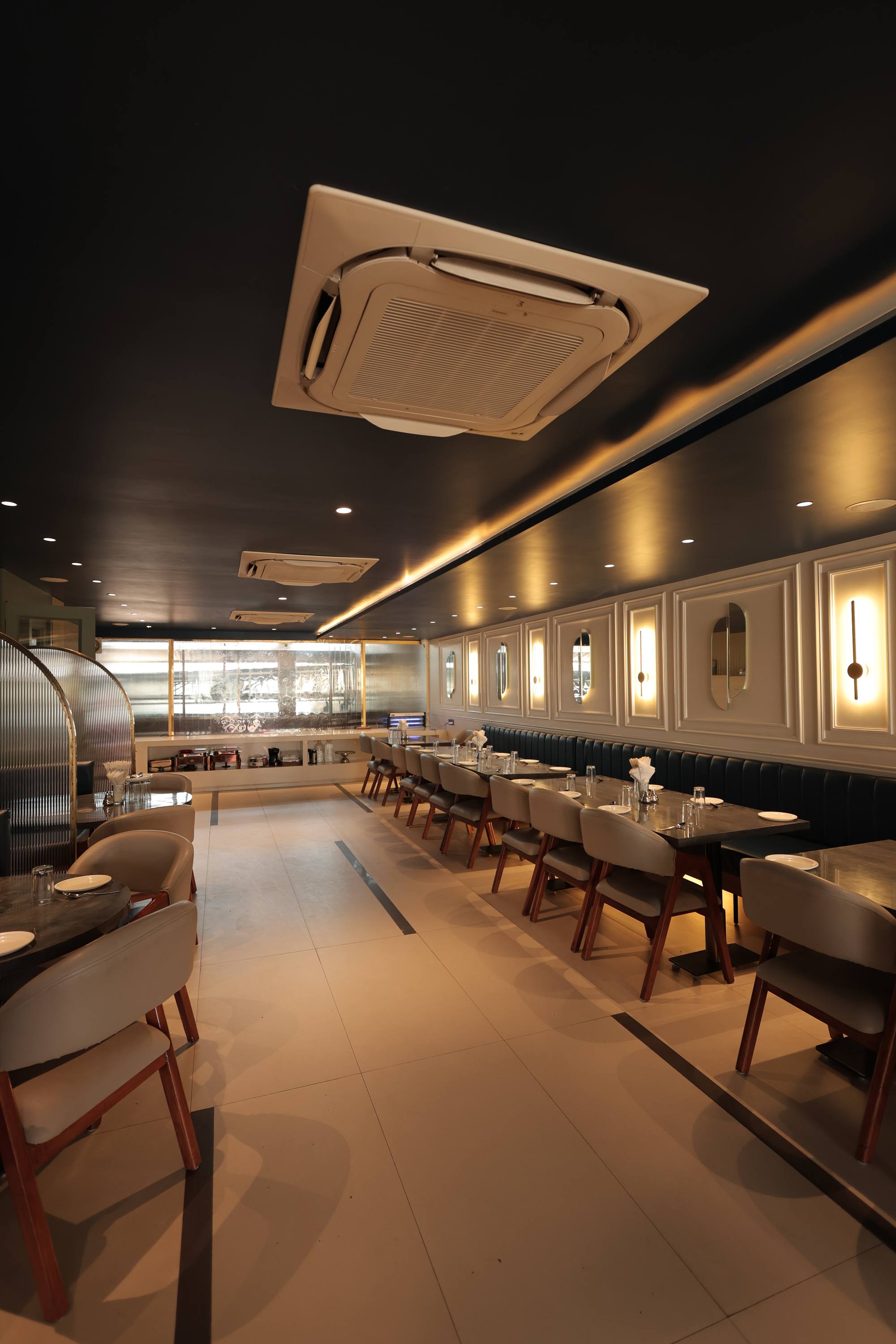 The restaurant at Hotel Relax Inn, set for service across its hundred seats