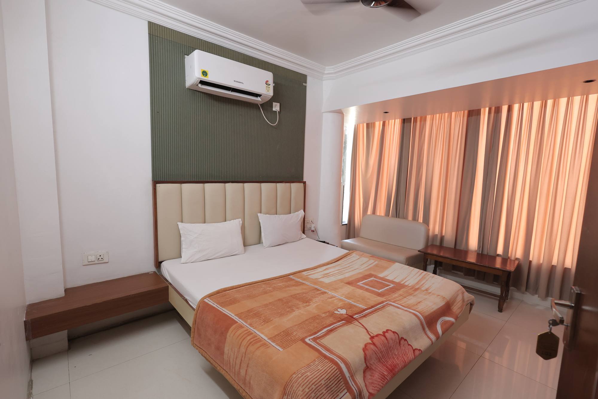 The Deluxe Room at Hotel Relax Inn, Banswara, with a king bed and split air conditioning