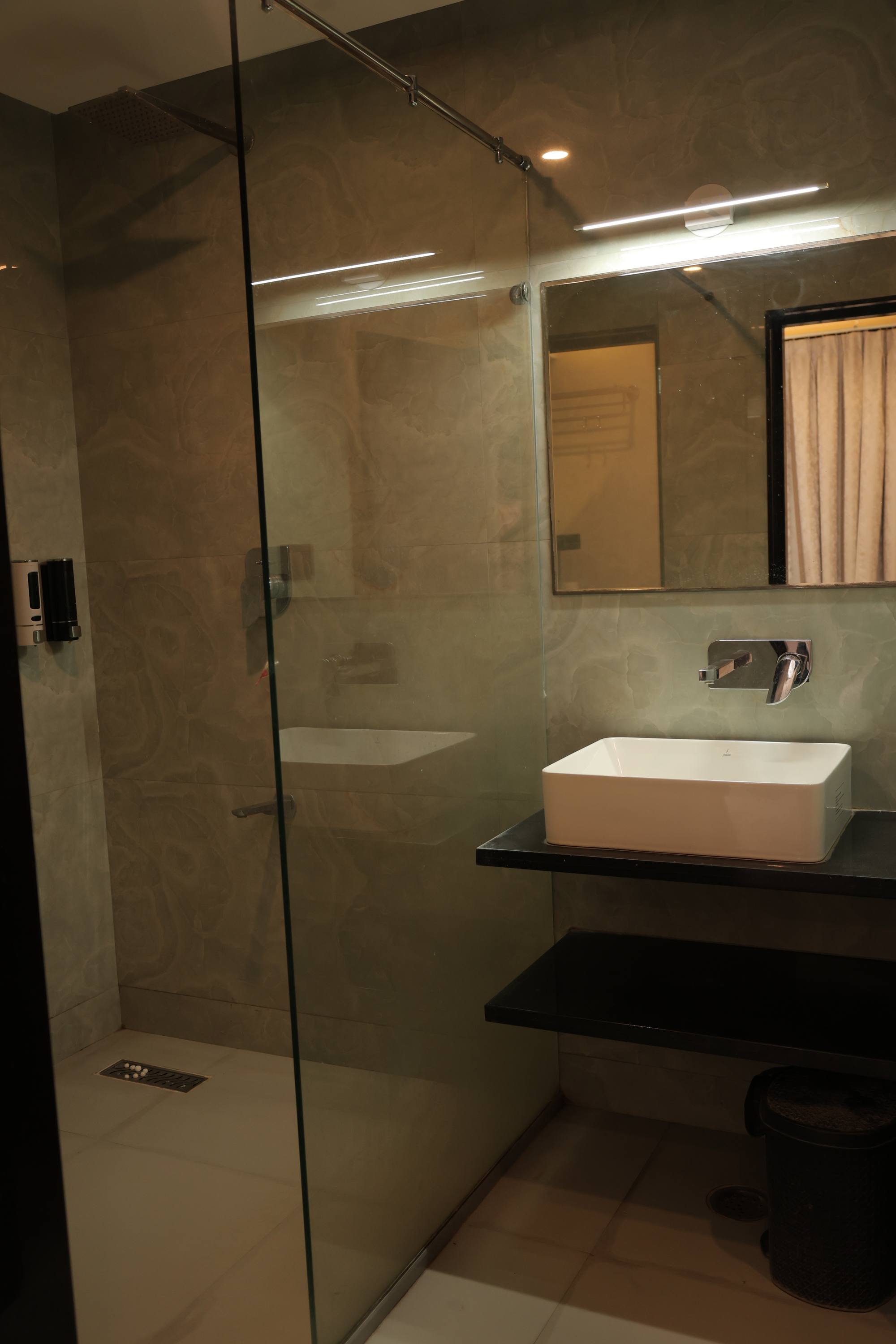 A second view of the Premium Room at Hotel Relax Inn showing the in-room amenities